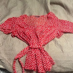 Cute flower top with belt.  Never worn.